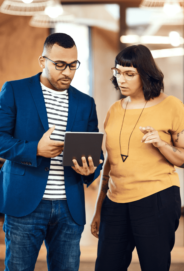 Sales representative showing product to a client using a tablet